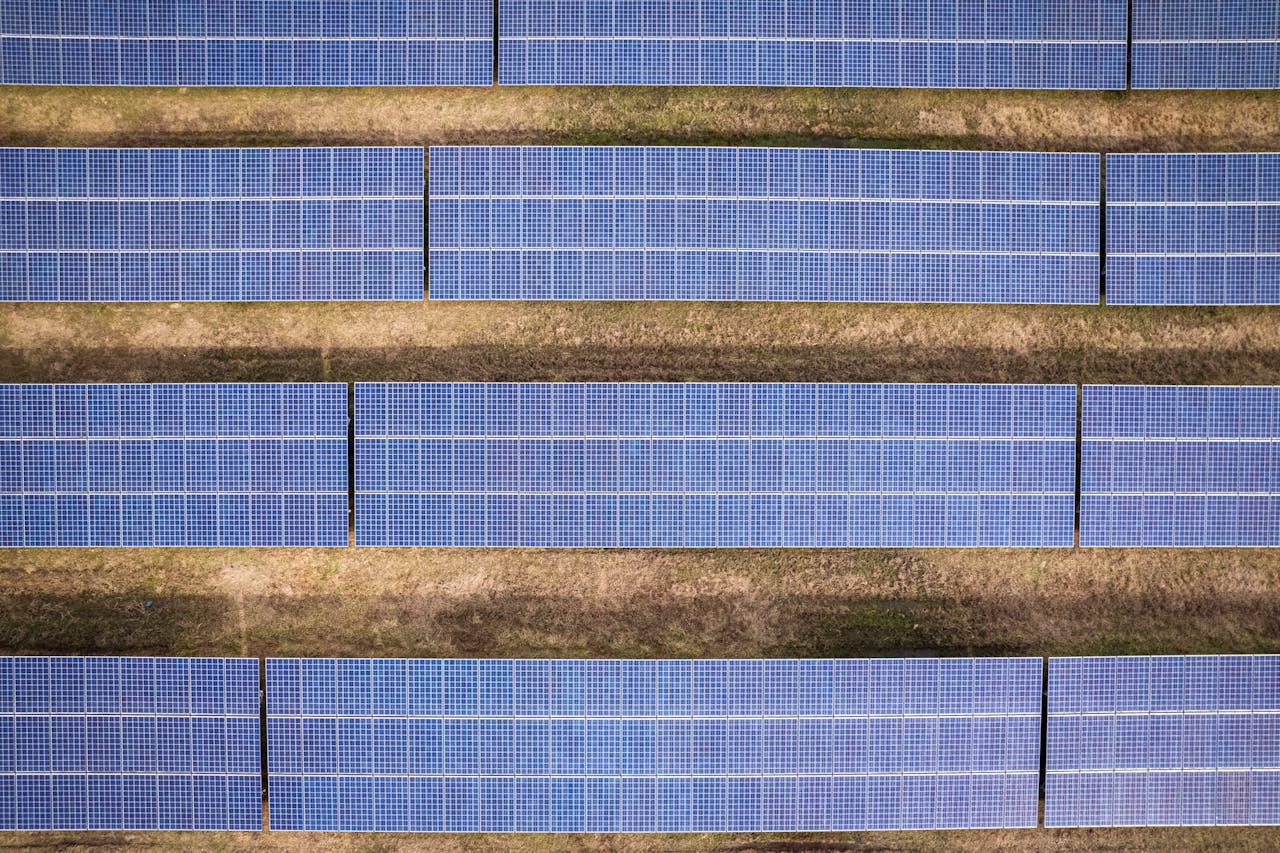services-04 Aerial shot of solar panels arranged in a field in Rocky Mount, NC.